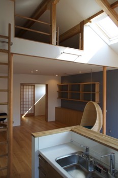  View of the living room from the kitchen with Japanese room doors closed. 